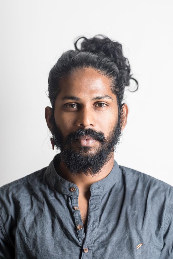 Anand Dhanakoti (32) is a Dancer, performer and choreographer. He was rained in Indian martial arts and yoga at the Kalari Gurukulam Bangalore, He was trained in classical ballet and jazz in the Lewis Foundation of Classical Ballet in Bengaluru and studied Flying Low with David Zambrano. Contemporary Dance School Hamburg Graduate. As a dancer and co-choreographer he has worked with Regina Rossi, Yolanda Morales Matej Kejzar, Abhilash Ningappa, Adam Linder and Ursina Tossi among others. His pieces 'Thuli', 'Kntsugi', 'Immer', 'Kelli' and 'Baalya' have been shown internationally. He also holds a BA degree in Economics, Political Science and Sociology from St. Joseph's College, Bangalore.